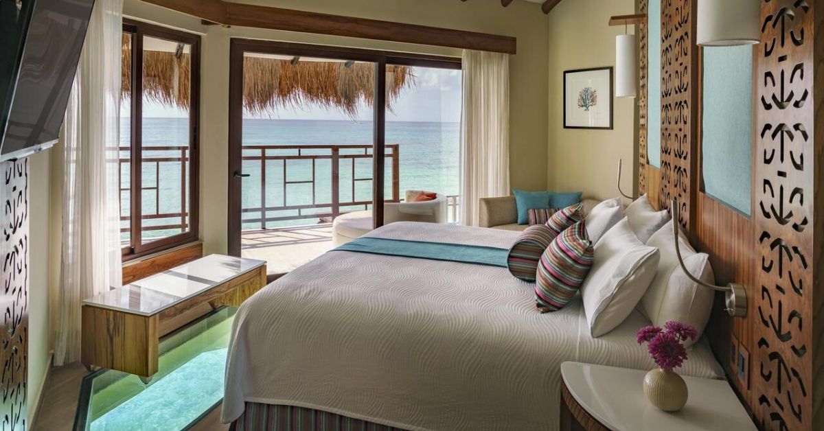 Palafitos Maroma — ocean-view guestroom interior